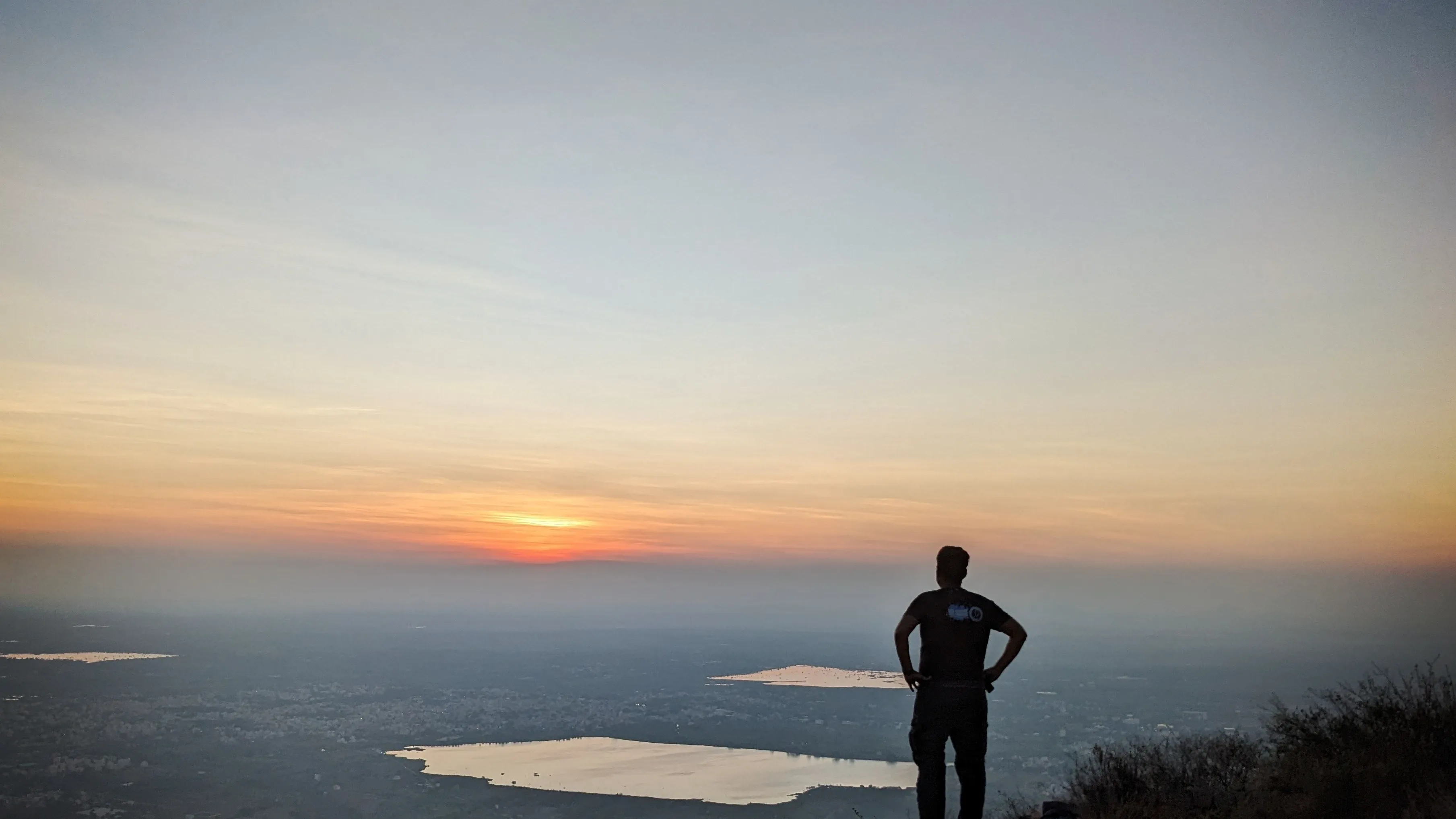 Sudhi looking at the sunrise , from Skandagiri Trek, near Bangalore
