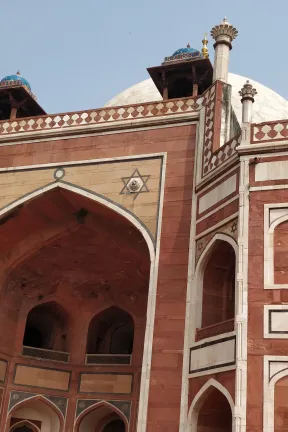 geometrical sandstone and marble pietra dura inlay patterns over the entrance iwan or high arc